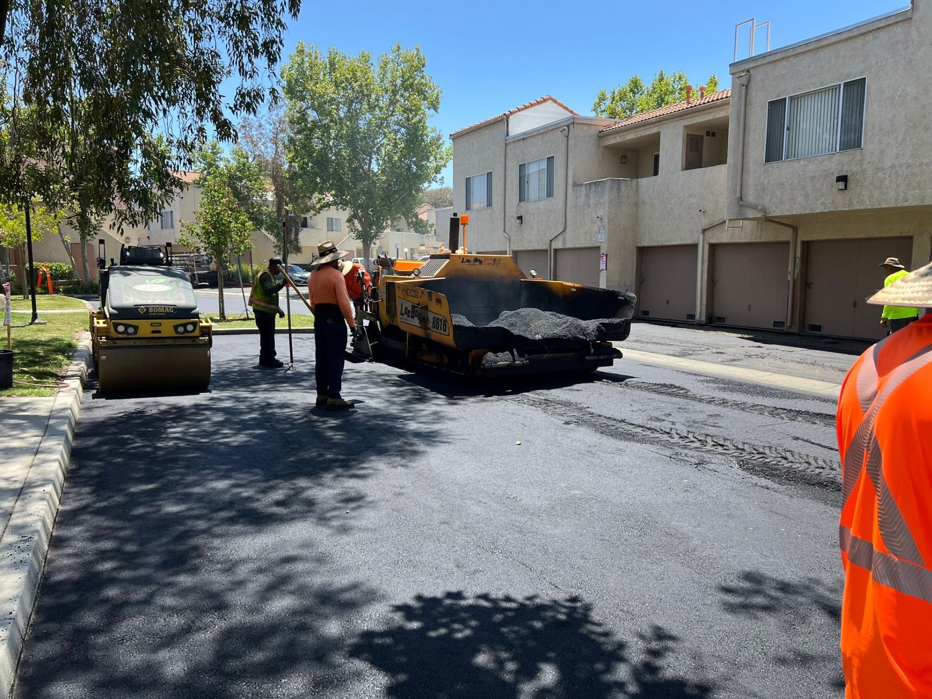 Paver & roller in action · Fresh hot-mix lay-down