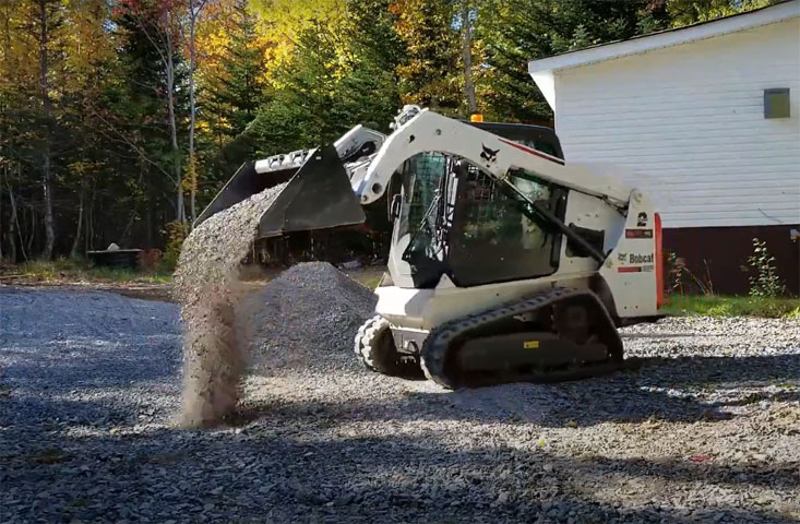 Compact track loader · Gravel placement
