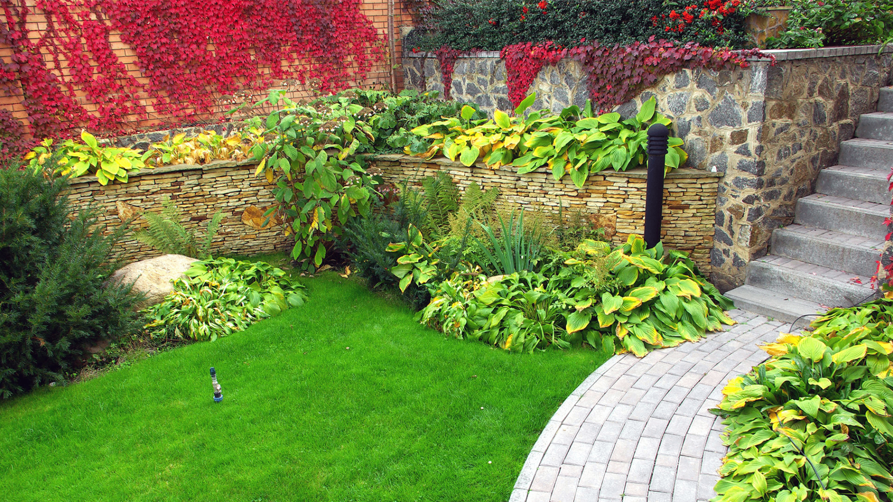 Landscaped garden with paver path & turf lawn